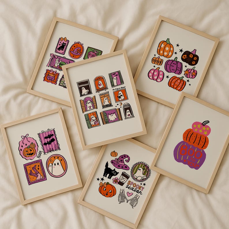 May include: A collection of framed Halloween-themed art prints. Each print features colorful illustrations of pumpkins, ghosts, bats, and other spooky elements. The prints are in light wood frames, perfect for seasonal decor.