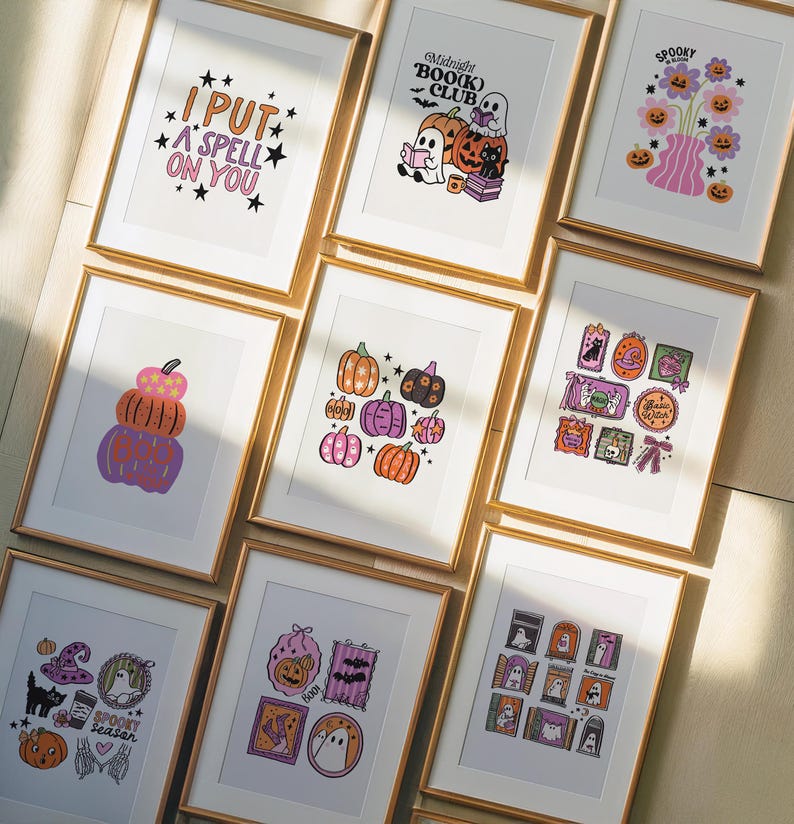 May include: A collection of framed Halloween-themed art prints. The prints feature various designs, including pumpkins, ghosts, and the text "I PUT A SPELL ON YOU" and "Midnight BOO(K) CLUB". The color palette includes orange, purple, and black.