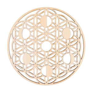 May include: A circular wooden decoration with a geometric design incorporating moon phases. The natural wood colour accentuates the intricate cut-out patterns, creating a celestial and artistic aesthetic. The design includes a flower of life pattern.
