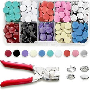 May include: A clear plastic organizer filled with colorful round snaps in various colors, including teal, white, red, pink, and silver. A red-handled snap setter tool and snap components are also included, ideal for crafting and sewing projects.