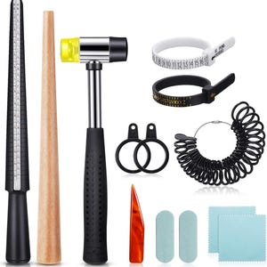 May include: A set of jewelry sizing tools including a ring mandrel, a ring sizer, a hammer, a ring sizer with alphabet markings, a ring sizer with numbered markings, a set of ring sizers, two polishing cloths, and a ring sizing tool with a handle.