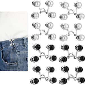 Puede incluir: Un conjunto de 10 broches plateados con piedras redondas blancas o negras. Los broches están diseñados para usarse como extensor de cinturón o para sujetar la ropa.