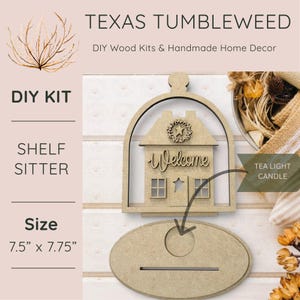 May include: A DIY wood kit shelf sitter from Texas Tumbleweed. The unfinished wooden house features a welcome sign, star, and wreath. The base is oval, and the size is 7.5" x 7.75". Includes a tea light candle holder.