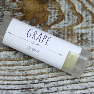 May include: A white tube of lip balm with a purple label that says "GRAPE LIP BALM".