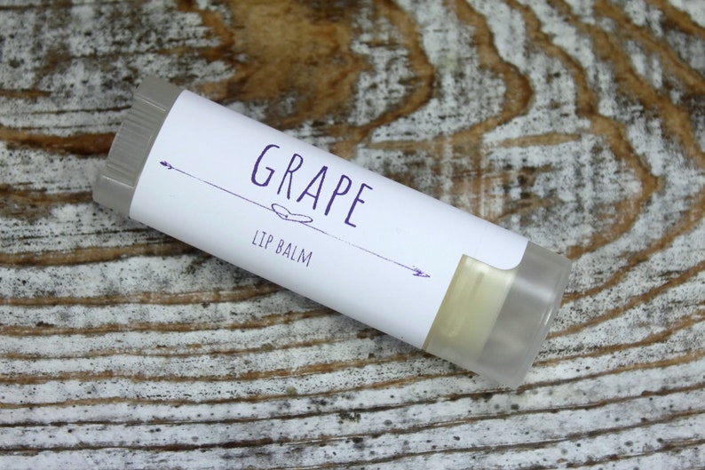 May include: A white tube of lip balm with a purple label that says "GRAPE LIP BALM".