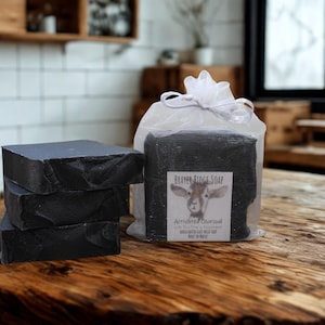May include: A set of three ceramic mugs with a speckled, matte finish. Each mug features a different color: light blue, cream, and gray. The mugs have a simple, modern design and a comfortable handle.
