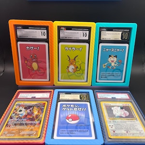 May include: Six graded Pok&eacute;mon trading cards in protective cases. The cards feature various characters and Japanese text. The cases are in orange, yellow, teal, red, blue, and clear. Each case has a grade of 10.