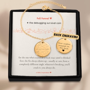 May include: A gold-toned chain bracelet featuring two circular charms. One charm is engraved with the text "we need new angles" and geometric line art. The second charm displays the text "Your custom message on the back" with a heart icon.