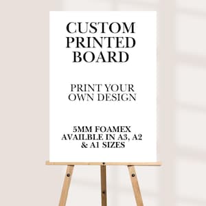 May include: A white custom printed board on a wooden easel. The board features the text "CUSTOM PRINTED BOARD" and "PRINT YOUR OWN DESIGN". It is available in A3, A2, and A1 sizes, made of 5mm Foamex.