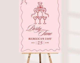 May include: A pink party sign on a wooden easel. The sign features red text and illustrations, including a champagne glass pyramid and the words "Party Time." It also includes the text "Rebecca's 21st" and the date and time.