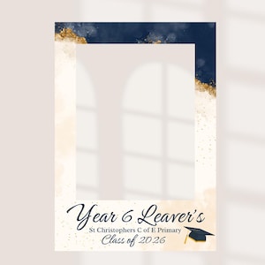 May include: A graduation photo frame with a navy blue and gold watercolour design. The frame includes the text "Year 6 Leaver's" and "Class of 2026" with a graduation cap illustration. The background is a soft beige.