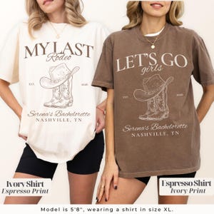 May include: Two t-shirts, one ivory and one espresso, each with a graphic of a cowboy hat and boots. The ivory shirt reads "MY LAST Rodeo" and the espresso shirt says "LET'S GO girls". Both shirts include "Serena's Bachelorette, Nashville, TN".