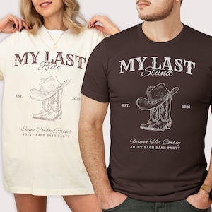 May include: Two t-shirts, one cream and one brown, with cowboy-themed graphics. The cream shirt reads "My Last Ride" with a cowboy hat and boots illustration. The brown shirt says "My Last Stand" with a similar design. Both shirts have "EST. 2025" and "Joint Bach Bash Party" text.