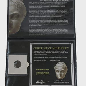 May include: A genuine ancient Roman bronze coin, displayed in a protective case, with a certificate of authenticity. The obverse features a portrait of Empress Fausta. The case also contains text about the history of Empress Fausta.