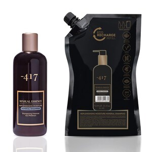 May include: A dark brown bottle and a black refill pouch of Sensual Essence Mineral Shampoo. The bottle has a gold cap and label with the brand name and product details. The refill pouch has a pump dispenser and the same branding.
