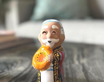 Handmade Uzbek Ceramic Figurine: Smiling Man with Bread, Central Asian Folk Art