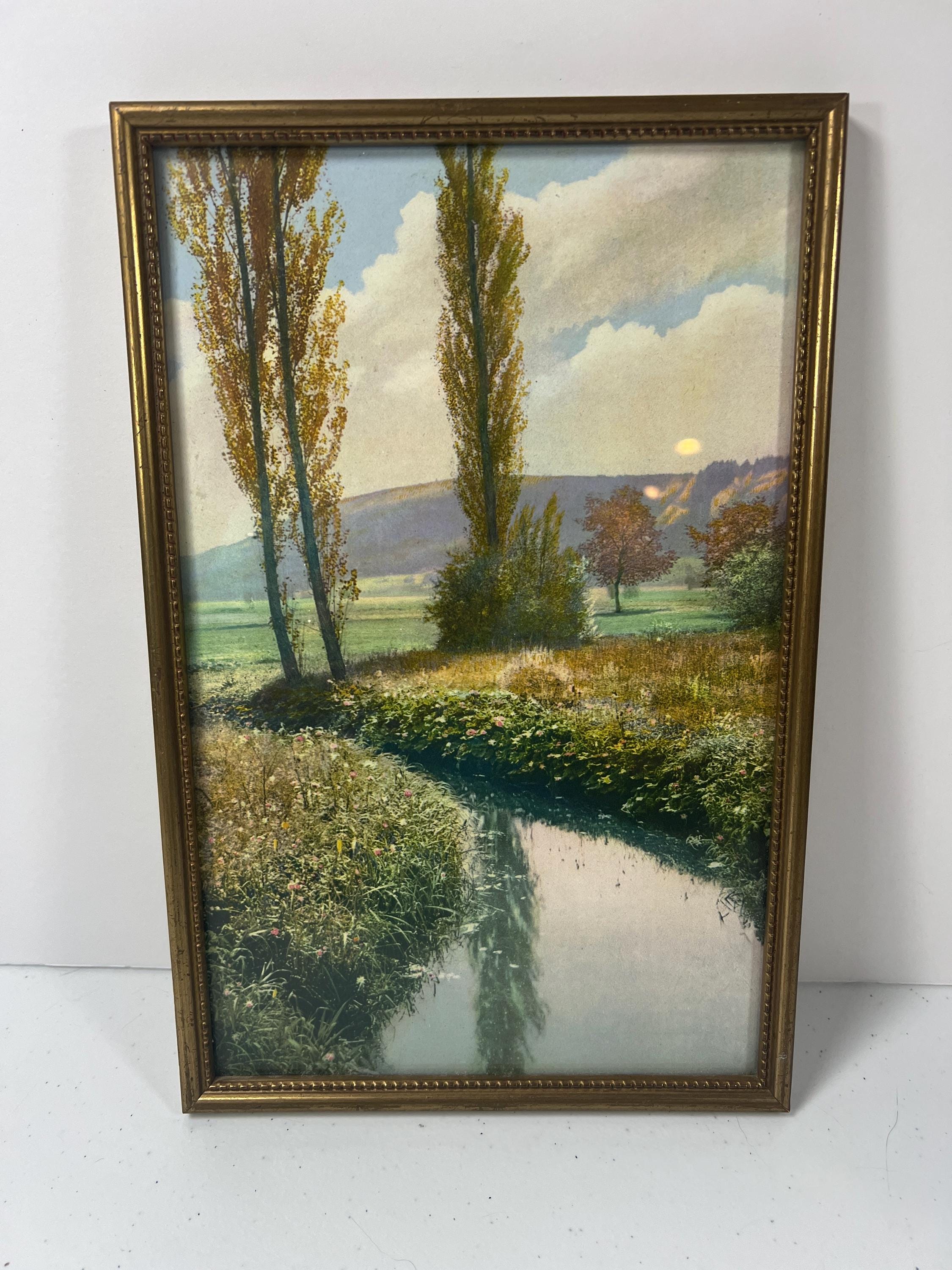 Vintage from 1950's landscape print of scenic river meadow.  gold toned wood frame.  11.25 x 7.5 inches