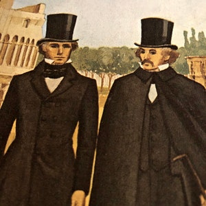 May include: Two men in black suits and top hats stand side-by-side. The man on the left has a dark-colored suit with a white collar and a black tie. The man on the right has a black suit with a white collar and a white cravat. Both men have a serious expression on their faces.