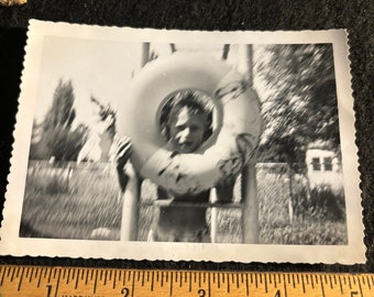 swimming 1950s era donut hole silly kid photo 3 1/2 x 5 black and white photo.