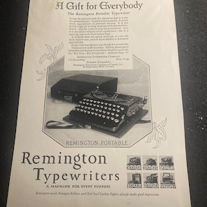 May include: A black Remington Portable typewriter with a white background. The text "A Gift for Everybody" is at the top of the image. The text "Remington Typewriters" is at the bottom of the image. The text "A Machine for Every Purpose" is below the text "Remington Typewriters".