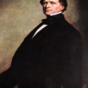 May include: A portrait painting of a man in a dark suit with a white shirt and a black bow tie. The man has dark hair and a serious expression on his face.