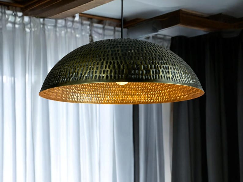 copper pendant lamp in minimalist setting, highlighting the contrast between exterior patina and golden interior