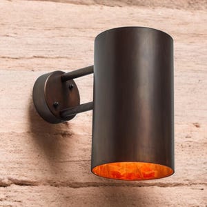 Oxidized black-patina copper wall sconce for outdoor use - modern cylindrical wall sconce with dark bronze exterior finish - copper sconce