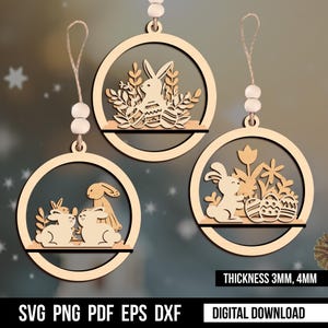 May include: Three wooden Easter bunny ornaments with intricate designs. The ornaments are shaped like circles and have a hole at the top for hanging. The designs feature bunnies, flowers, and eggs. The text "THICKNESS 3MM, 4MM" and "DIGITAL DOWNLOAD" are visible at the bottom of the image.