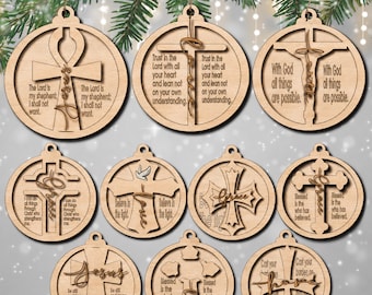 May include: Ten circular wooden ornaments featuring laser-cut cross designs and religious text. Each ornament includes a hanging loop at the top. The designs incorporate various cross styles, script lettering, and phrases such as The Lord is my shepherd.