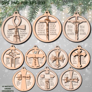 Puede incluir: Una colección de diez adornos navideños de madera con temas religiosos. Cada adorno presenta un diseño de cruz con varias inscripciones, incluyendo "Jesús", y citas inspiradoras. Los adornos están cortados con láser y listos para colgar.