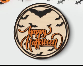 May include: A round wooden Halloween decoration with the words "Happy Halloween" in orange script, surrounded by black bats. The design is laser cut. The bottom of the image has the text "SVG PNG PDF EPS DXF" and "LASER CUT FILE".