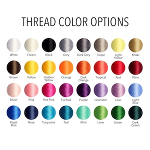 May include: A colour chart showing thread colour options. The chart features a range of colours, including white, black, grey, yellow, orange, red, pink, purple, blue, and green. The text "THREAD COLOUR OPTIONS" is at the top.