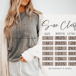 May include: A charcoal grey short-sleeve t-shirt with a chest pocket and a size chart overlay. The chart lists sizes S through 3X with corresponding width and length measurements in inches, ranging from 18.25 to 27.75 inches wide and 26.5 to 32.5 inches long.