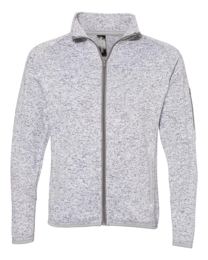 May include: A grey and white flecked fleece zip-up jacket with a stand-up collar and zipped pockets.