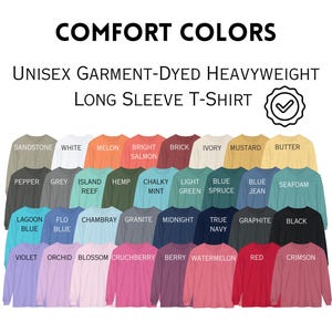 May include: A display of unisex long-sleeve t-shirts in various colors, including Sandstone, White, Melon, and Crimson. The shirts are garment-dyed heavyweight, with the words "COMFORT COLORS" and "UNISEX GARMENT-DYED HEAVYWEIGHT LONG SLEEVE T-SHIRT" in the image.