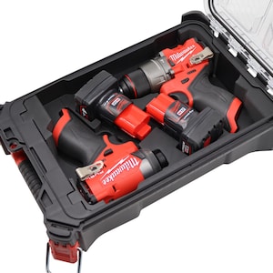 May include: A black and red power tool kit with a clear lid. The kit contains several red and black power tools, including a drill and impact driver. The tools are neatly organized within the black case.