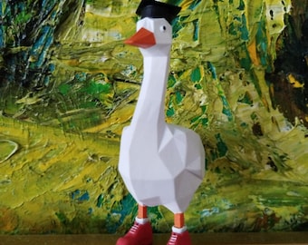 Figura geométrica de ganso: decoración de escritorio original con zapatos rojos