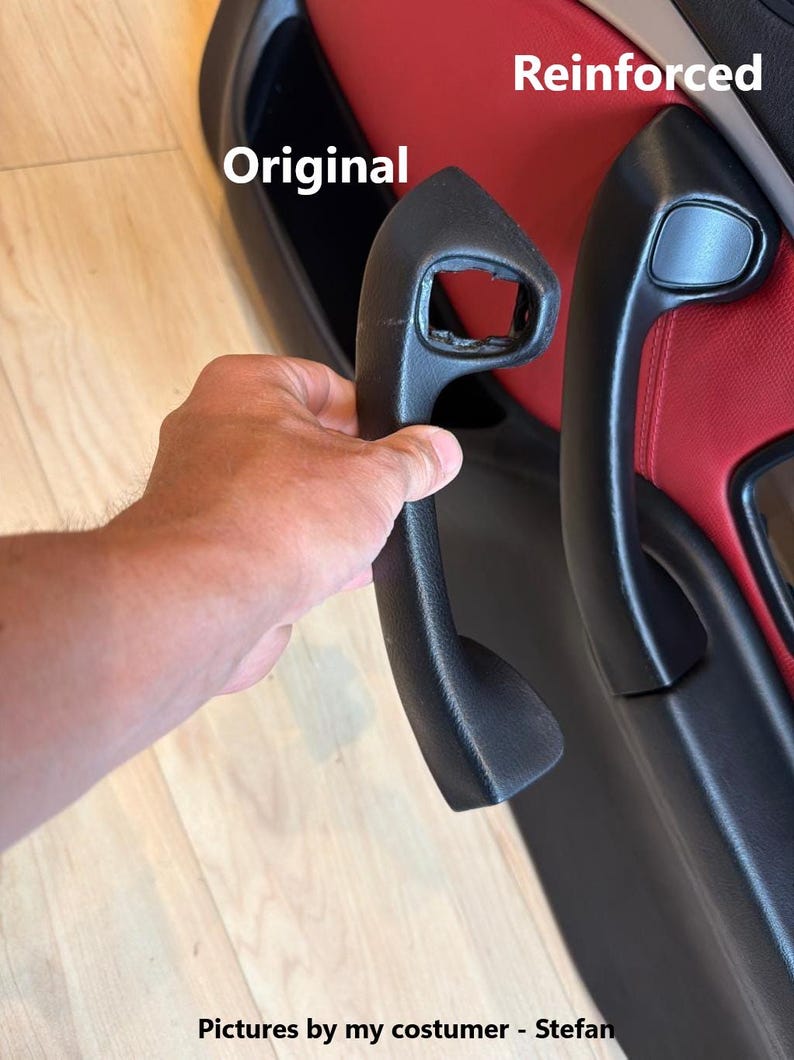 May include: A comparison of two black car door handles. One handle is labeled Original and shows significant damage with a broken section. The other handle is labeled Reinforced and appears intact and fully functional, mounted on a red and black door panel.