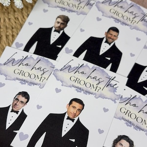 May include: A collection of rectangular game cards titled Who has the GROOM? Scratch to reveal. Each card features a printed illustration of a person wearing a black tuxedo with a white shirt and black bow tie, accented by small light purple hearts.