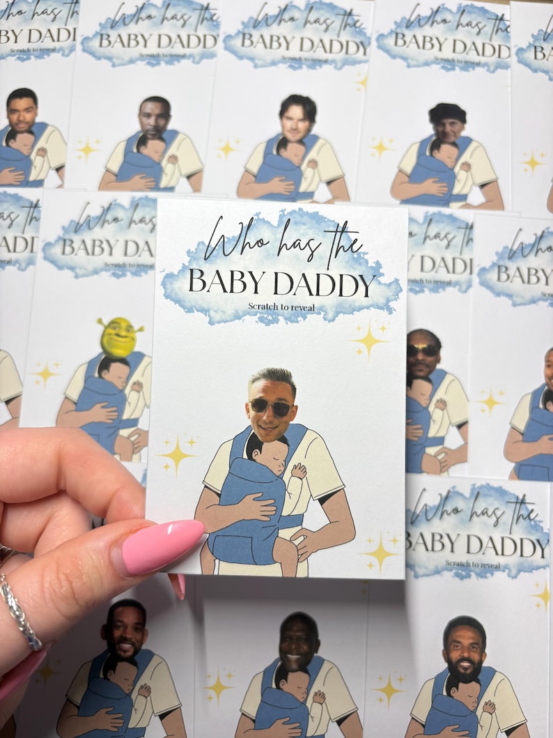 May include: Cards with illustrations of men holding babies in carriers. The text "Who has the BABY DADDY" is displayed on the cards. The cards have a scratch-to-reveal feature. The cards are white with blue and gold accents.