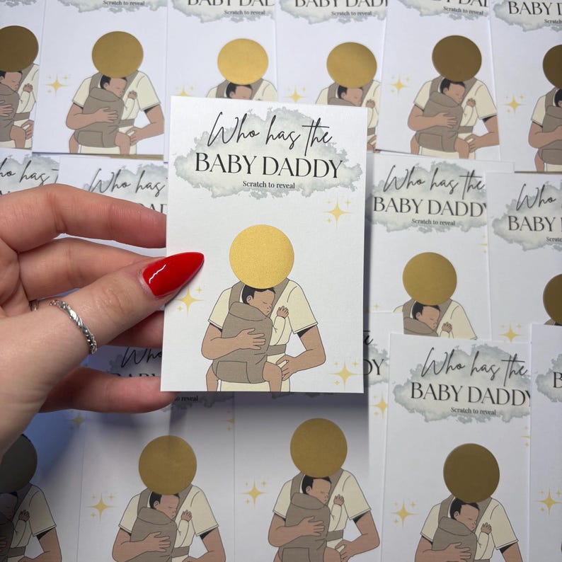 May include: A stack of "Who has the BABY DADDY" scratch-off cards. Each card features an illustration of a person holding a baby in a carrier. The text "Who has the BABY DADDY" is printed on the card.