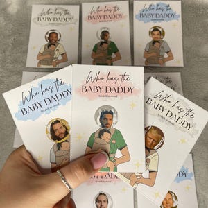 May include: A collection of white cards with the text "Who has the BABY DADDY" and "Scratch to reveal". Each card features a cartoon illustration of a person holding a baby in a carrier. The cards have different celebrity faces.