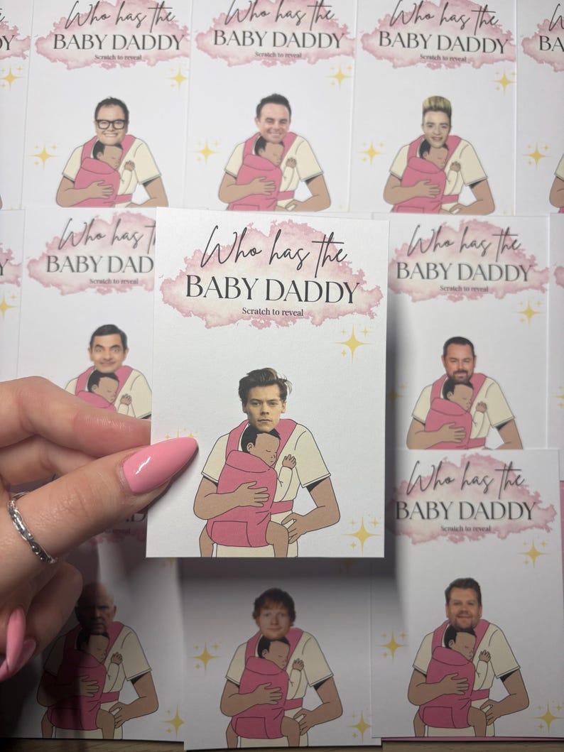 May include: Cards with illustrations of men holding babies in pink carriers. The cards have the text "Who has the BABY DADDY" with "Scratch to reveal" underneath. The cards feature different celebrities.