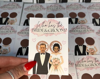 May include: A rectangular scratch-off game card featuring the text Who has the BRIDE & GROOM? Scratch to reveal. The card displays an illustration of a bride and groom with a scratchable circular area over their faces, revealing a couple's portraits.