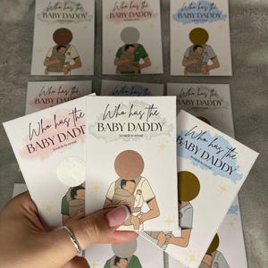 May include: A collection of scratch-off cards with the text "Who has the BABY DADDY" in various colors. Each card features an illustration of a person holding a baby in a carrier. The cards are designed for a baby shower game.