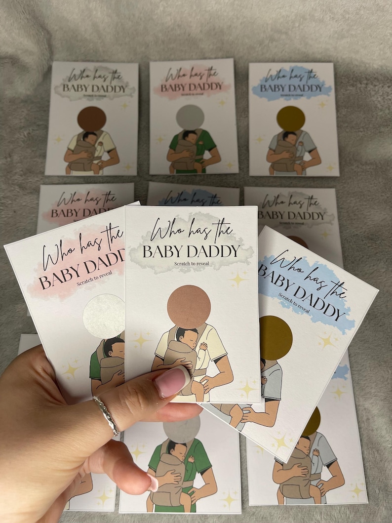 May include: A collection of scratch-off cards with the text "Who has the BABY DADDY" in various colors. Each card features an illustration of a person holding a baby in a carrier. The cards are designed for a baby shower game.