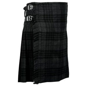 May include: A black and grey kilt with a fringed bottom and a buckle fastening. The kilt is made of a woven fabric with a tartan pattern.