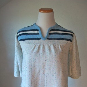 Confetti and sky blue knit cropped swing top with swing bell sleeves