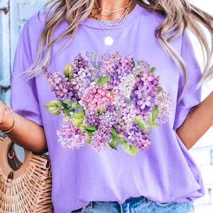 Lilac Garden T-Shirt – Cottagecore Floral Tee, Violet Flower Shirt for Women, Soft Aesthetic Spring Top, Nature-Inspired Gift Idea