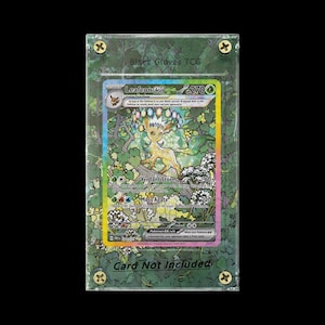 May include: A Pokemon trading card, featuring Leafeon EX, is encased in a clear acrylic holder. The card has a colorful design with a forest theme and the text "Card Not Included" is visible at the bottom.
